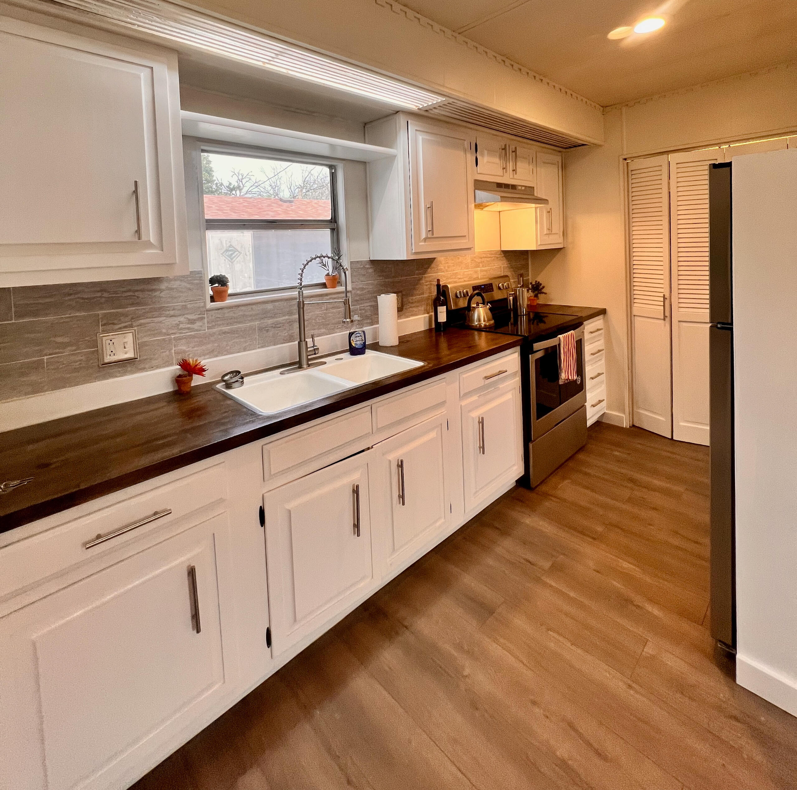 After pic of full cabinet repaint and full kitchen restoration